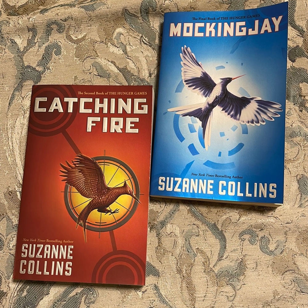 Catching Fire and Mocking Jay by Suzanne Collins